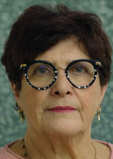 Portrait de Nicole Bergamini en situation professionnelle, souriant et confiant